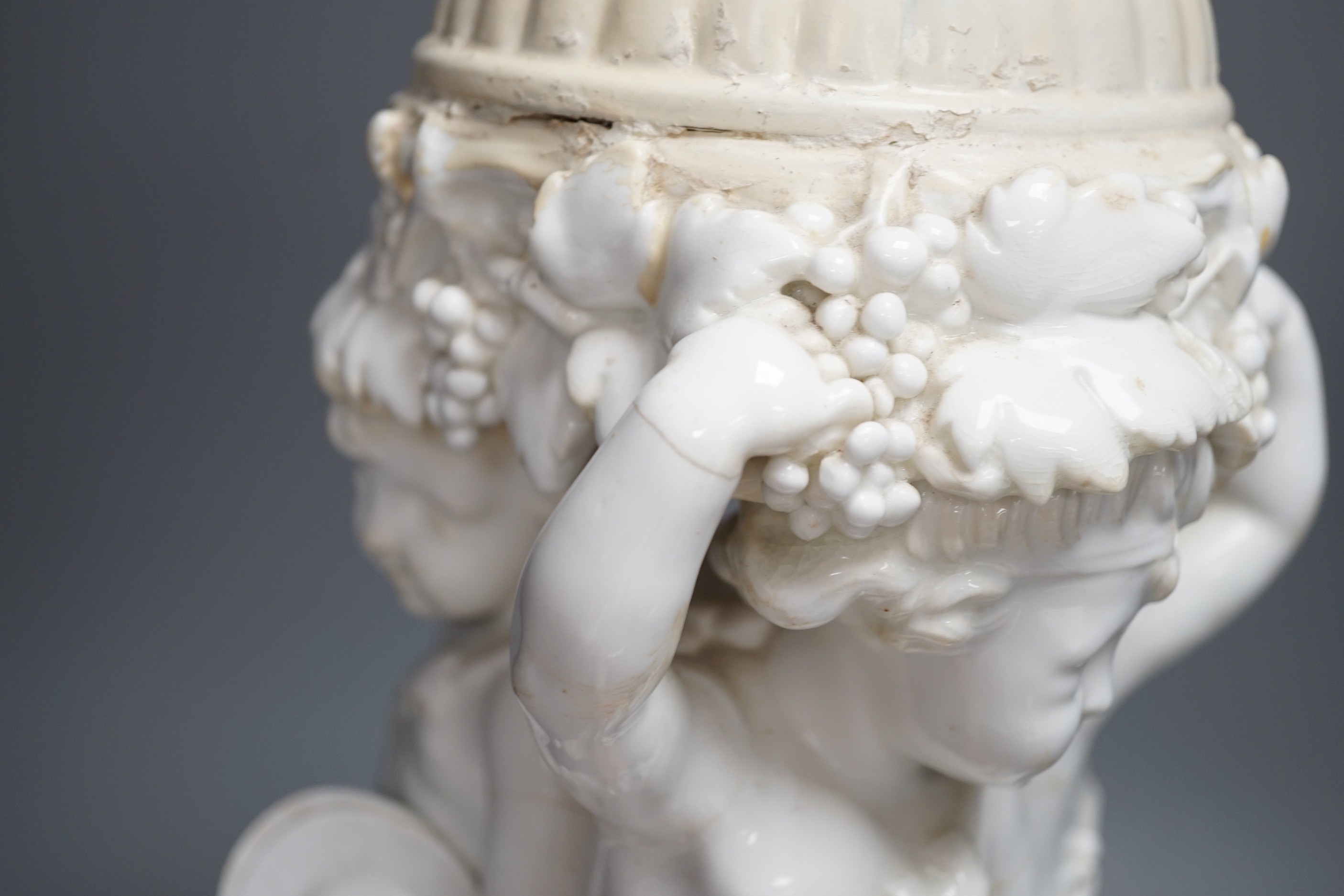 A Victorian English porcelain cherub centrepiece, now mounted as a lamp (restored), possibly Moore Bros., 71 cm height to top of lamp fitting